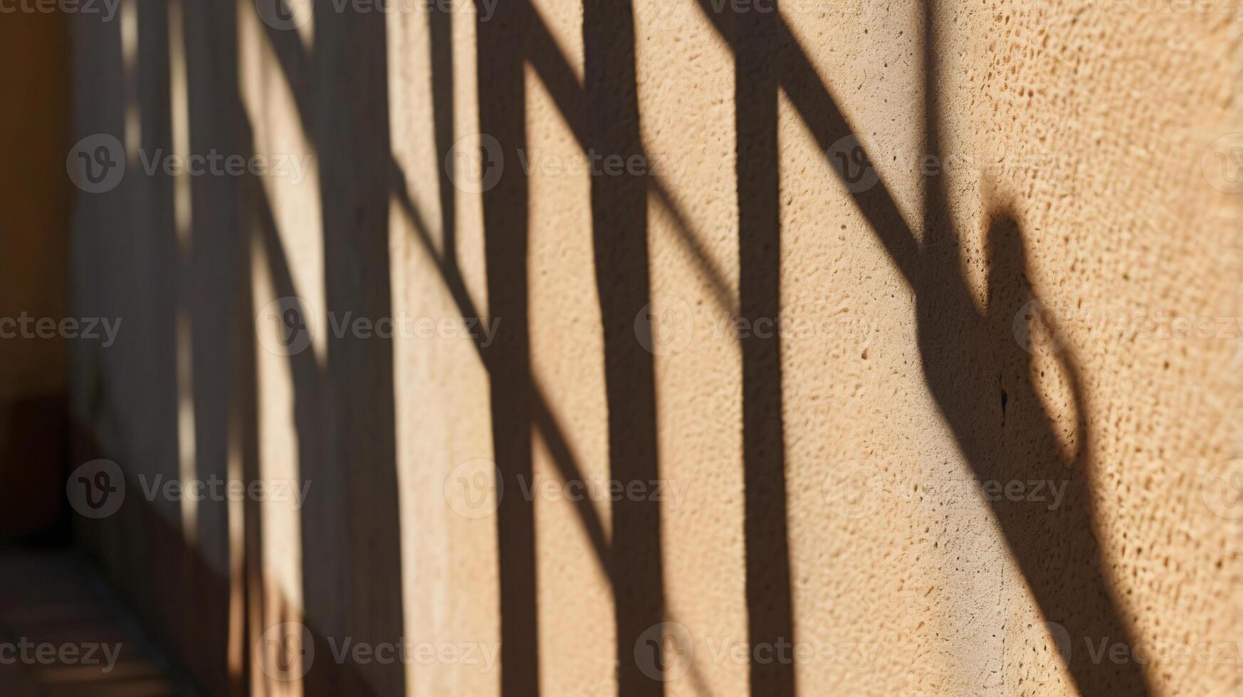 Grunge rough concrete wall with tree shadows on asphalt. Background for copy space. photo