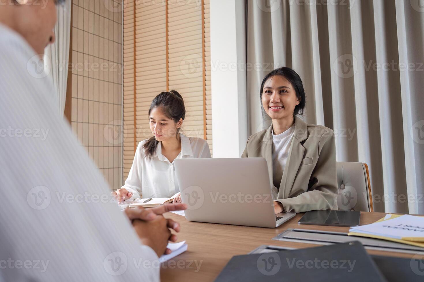 Business Team Collaborating in Modern Office, Exchanging Ideas and Discussing Work Strategies photo