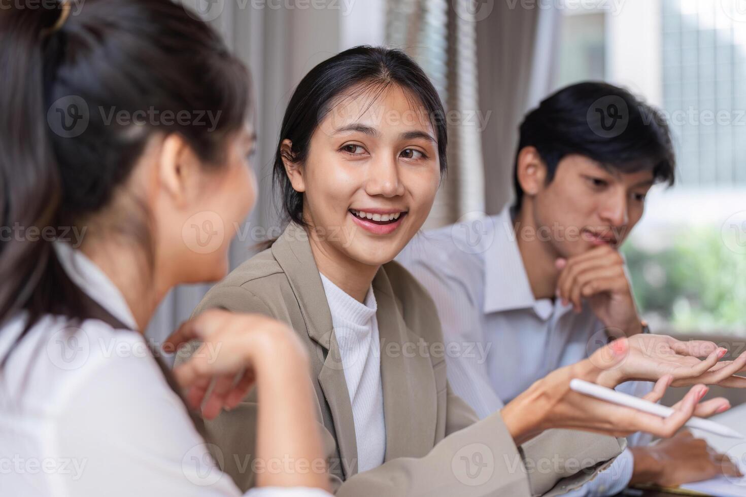 Business Team Engaging in a Collaborative Discussion and Idea Exchange in a Modern Office Setting photo