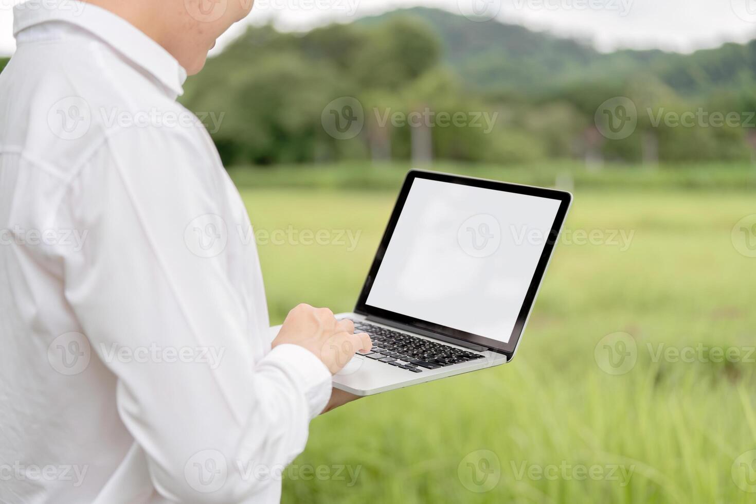 Agricultural Researchers Utilizing Modern Technology in Field for Enhanced Crop Analysis and Data Collection photo