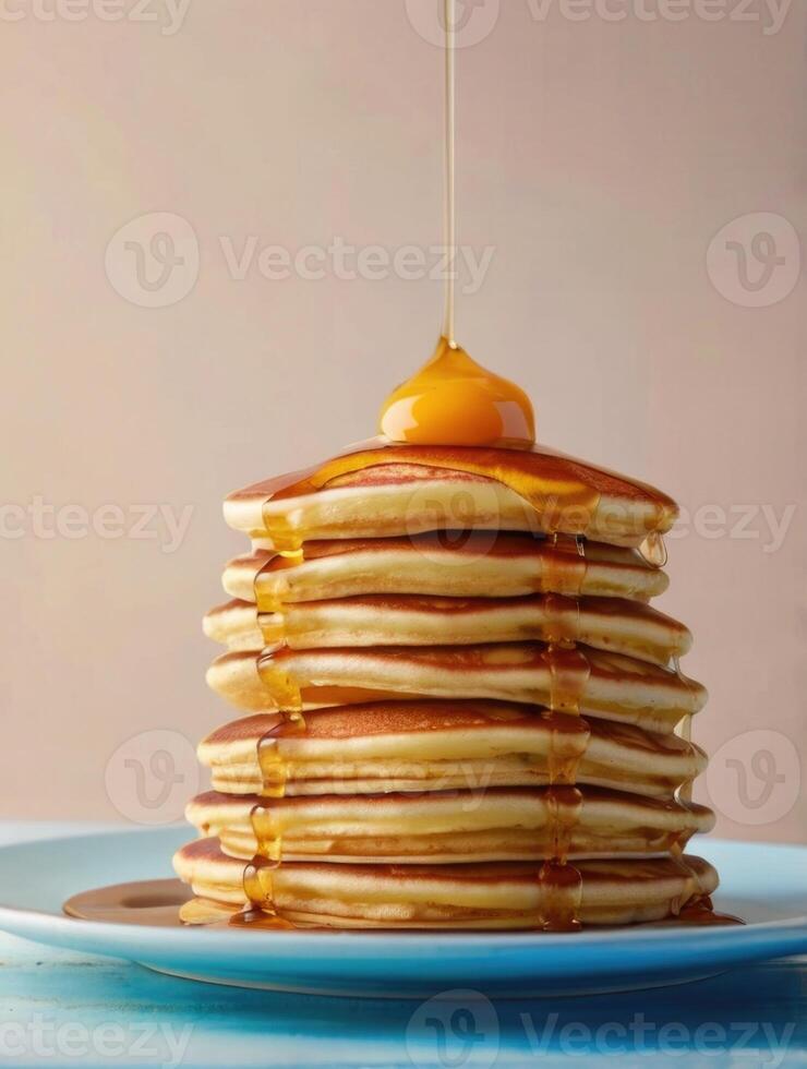 a stack of pancakes with syrup photo