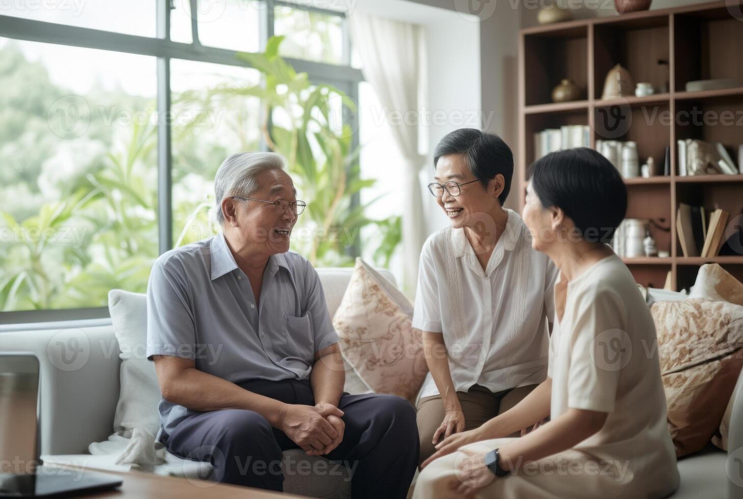 A diverse mix of Asian elderly individuals gathers in a nursing home, seated and engaged in conversation, fostering companionship, sharing stories, and exchanging wisdom in a harmonious photo