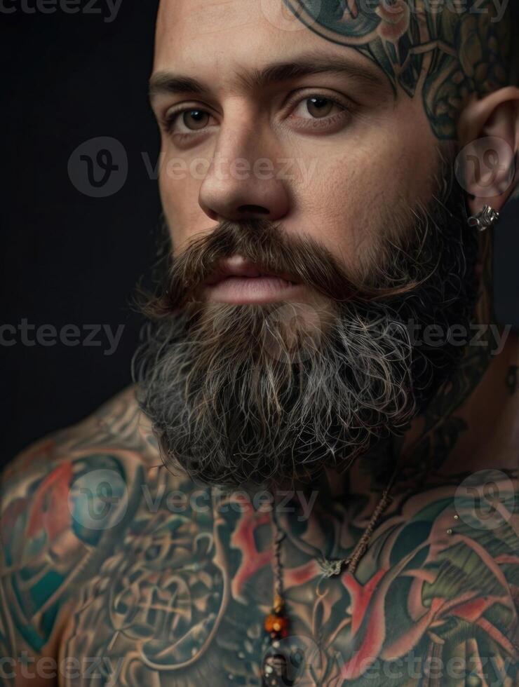 a man with tattoos and a beard photo