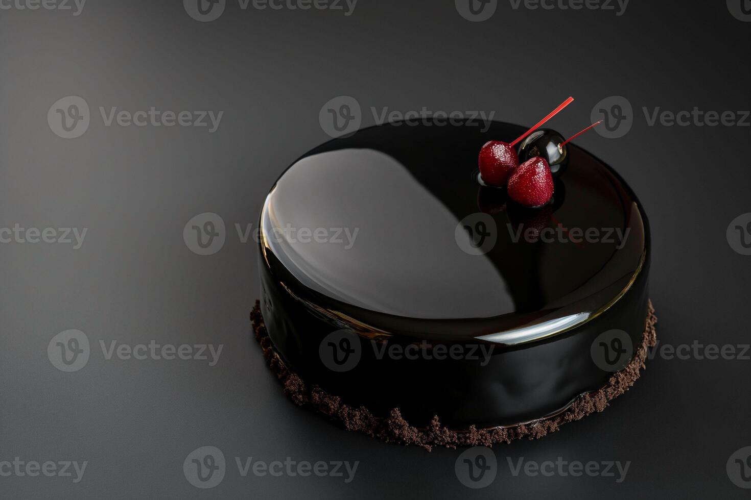 A sleek, black mirror glazed cake with a cherry on top, presented on a dark, reflective surface. This minimalist and modern aesthetic, for high end dessert advertising or culinary art showcases. photo