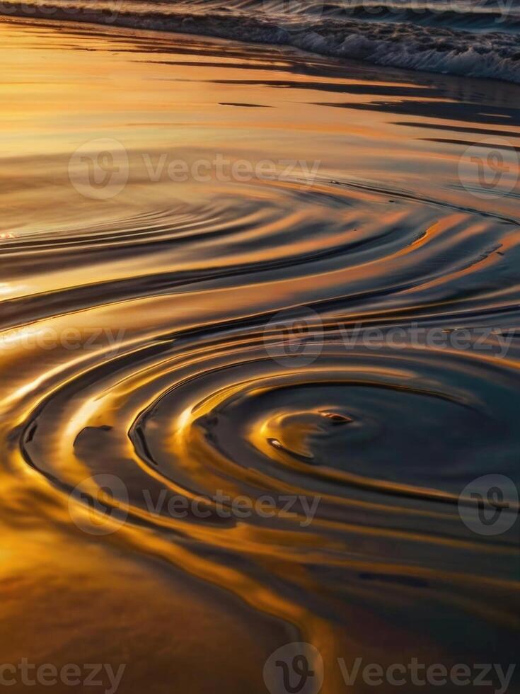 a wave on the beach at sunset photo