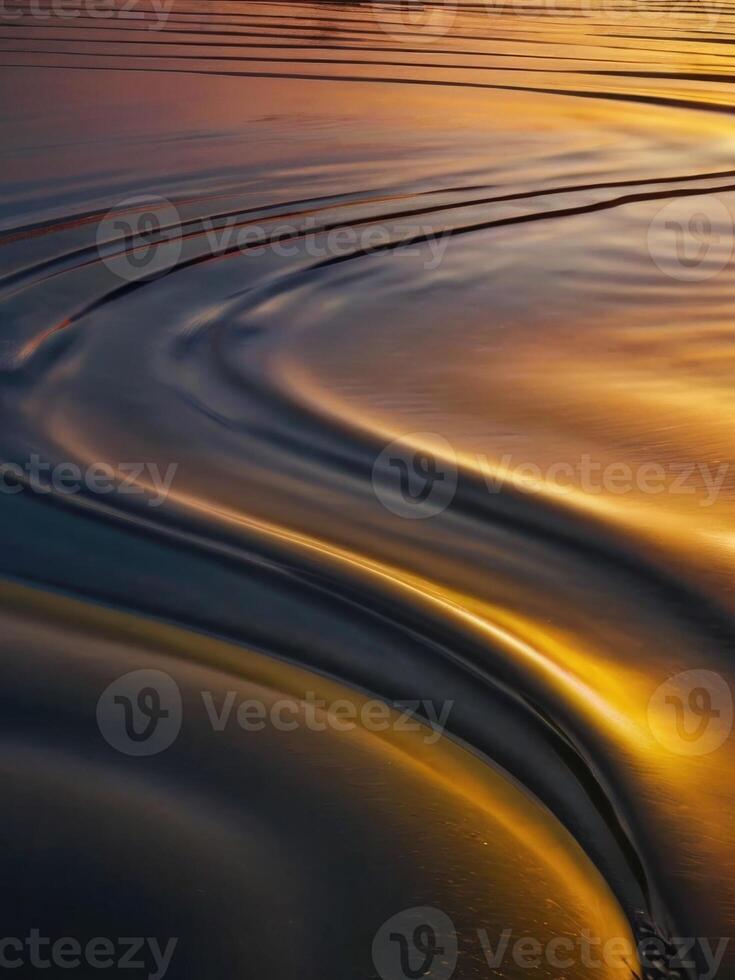 a wave on the beach at sunset photo