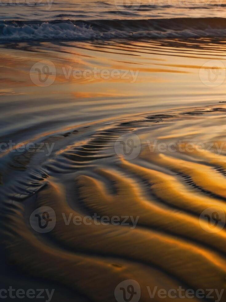 a wave on the beach at sunset photo