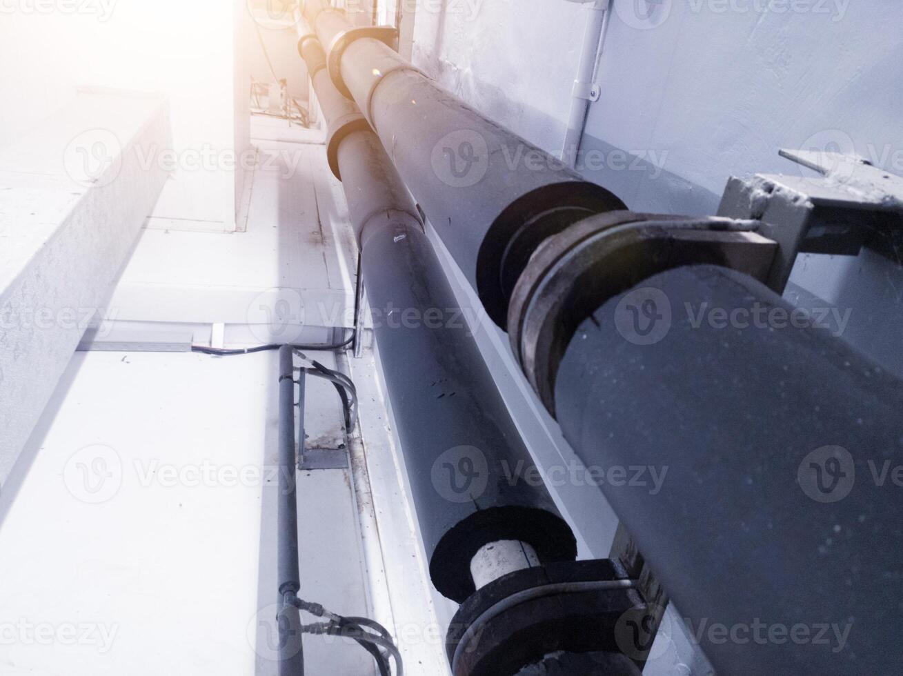 Industrial pipe line with insulation for water chiller circulation on the machinery hatchering. photo
