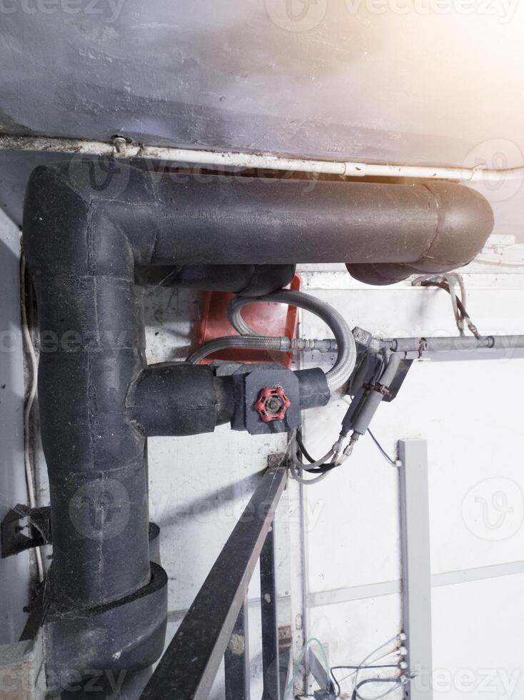 Industrial pipe line with insulation for water chiller circulation on the machinery hatchering. photo