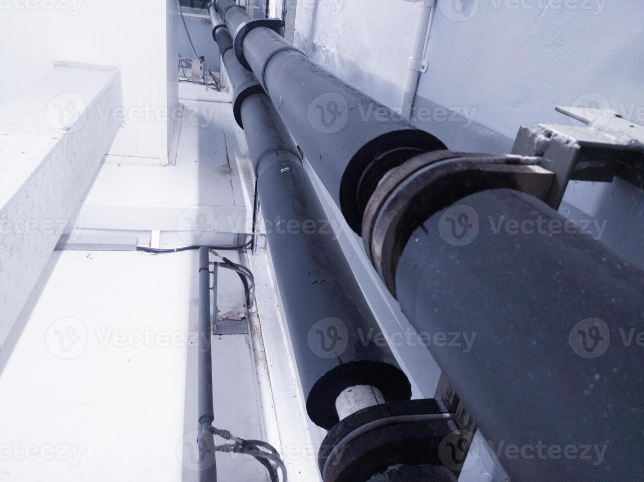 Industrial pipe line with insulation for water chiller circulation on the machinery hatchering. photo