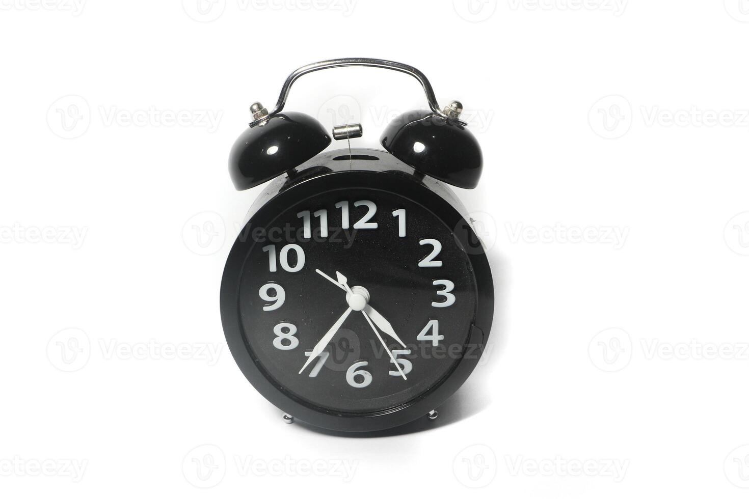 Classic black table clock isolated on a white background. copy space photo