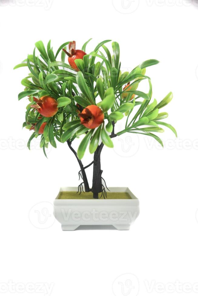 decorative tree made of plastic on a white background. Isolated on white. photo