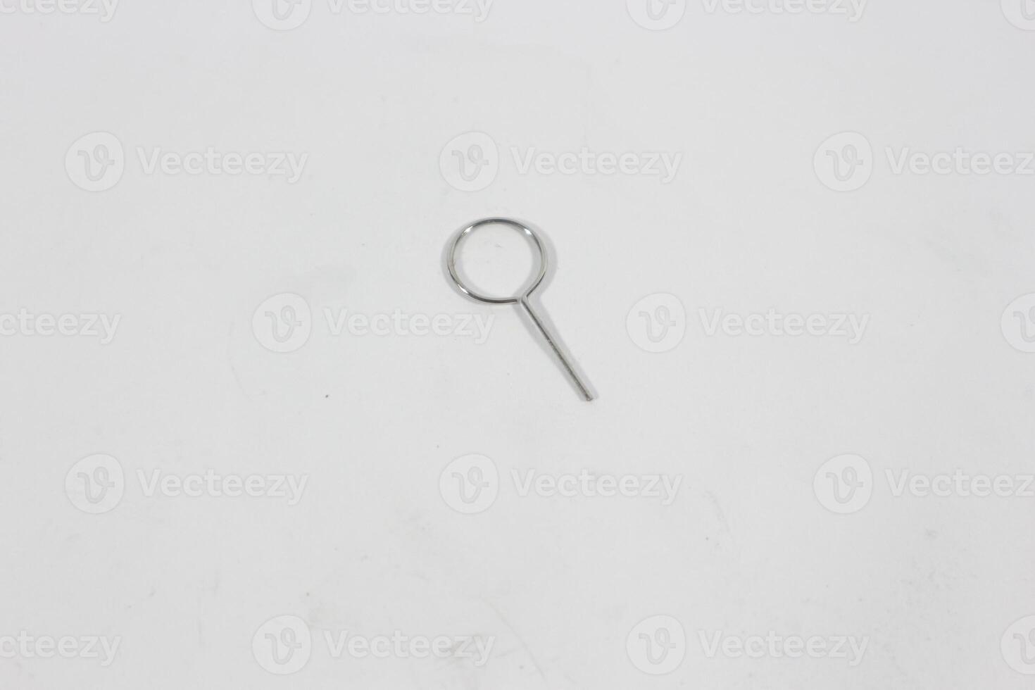 SIM card ejector pin isolated on white background photo