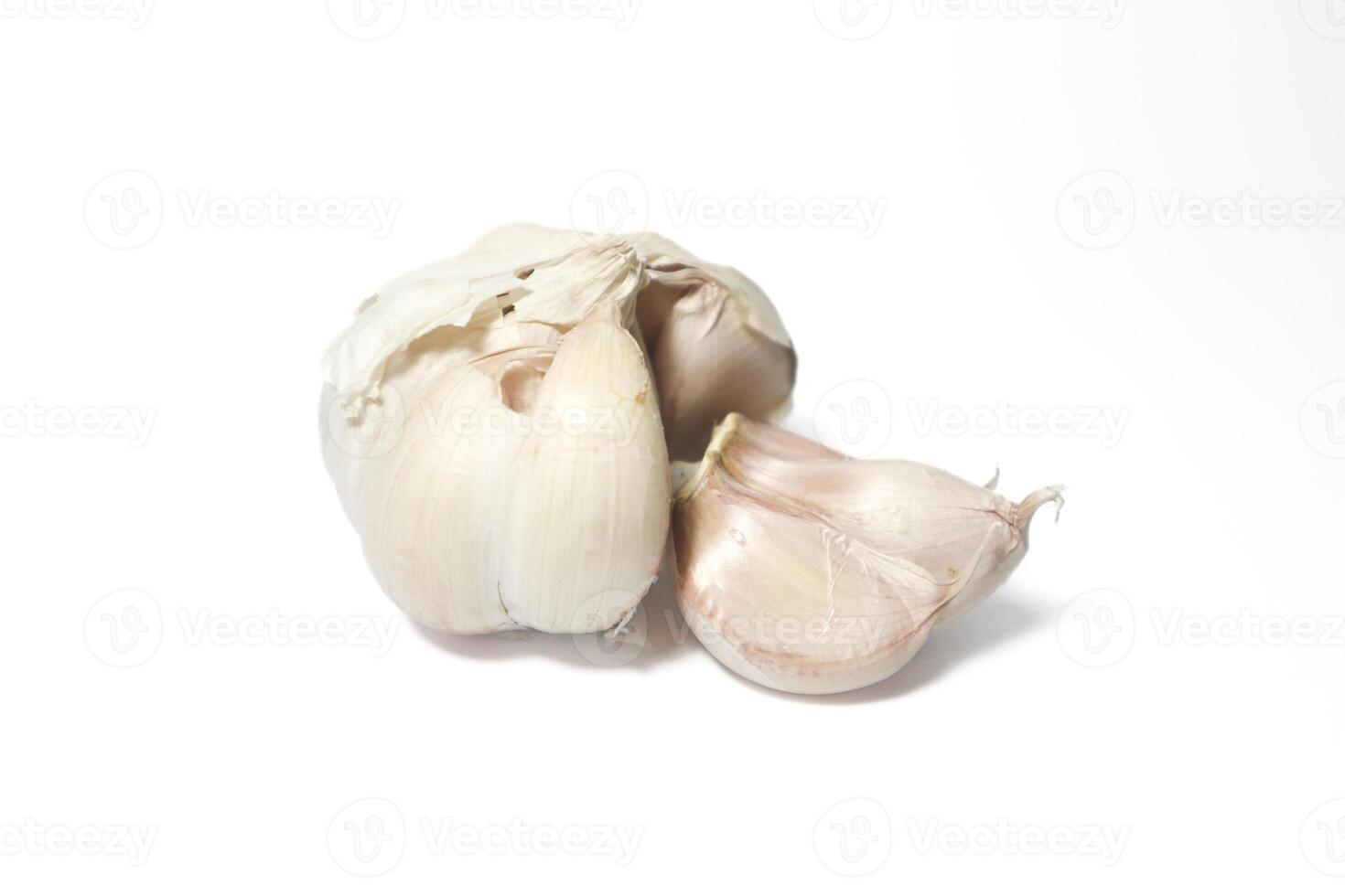 Isolated garlic. Raw garlic with segments isolated on white background photo