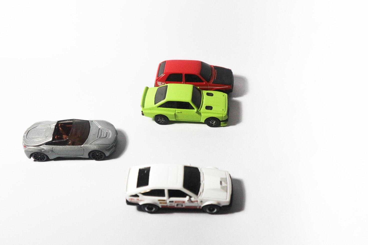 Lampung, Indonesia - 1st July 2024, group of hotwheels car toy on isolated white background photo