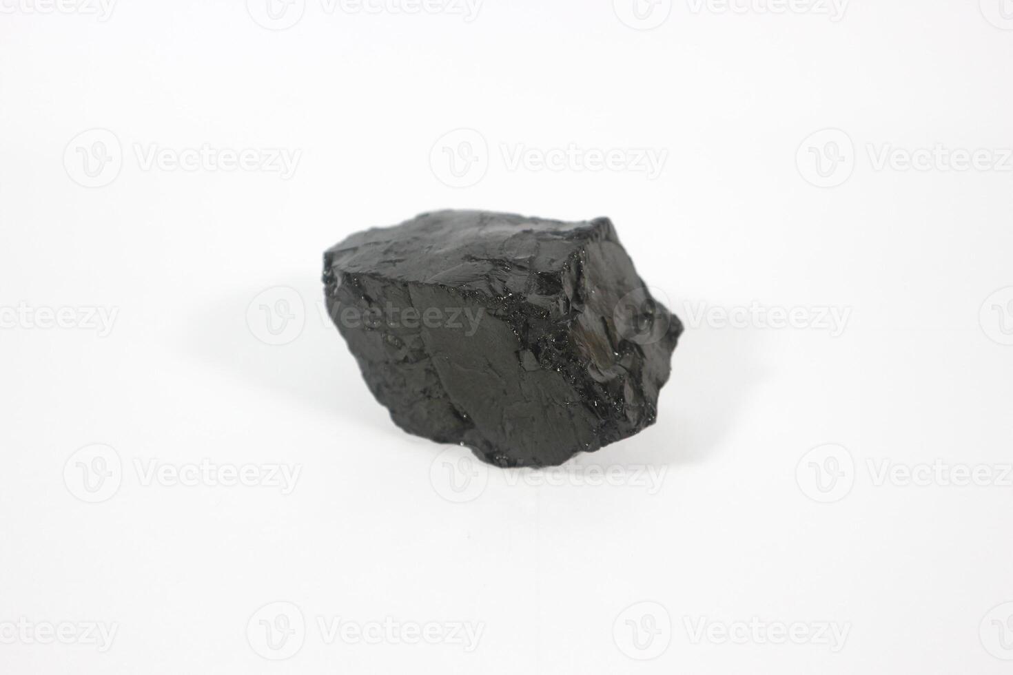 coal on a white background. Isolated on white. Coal can be a fuel that is cheaper than others photo
