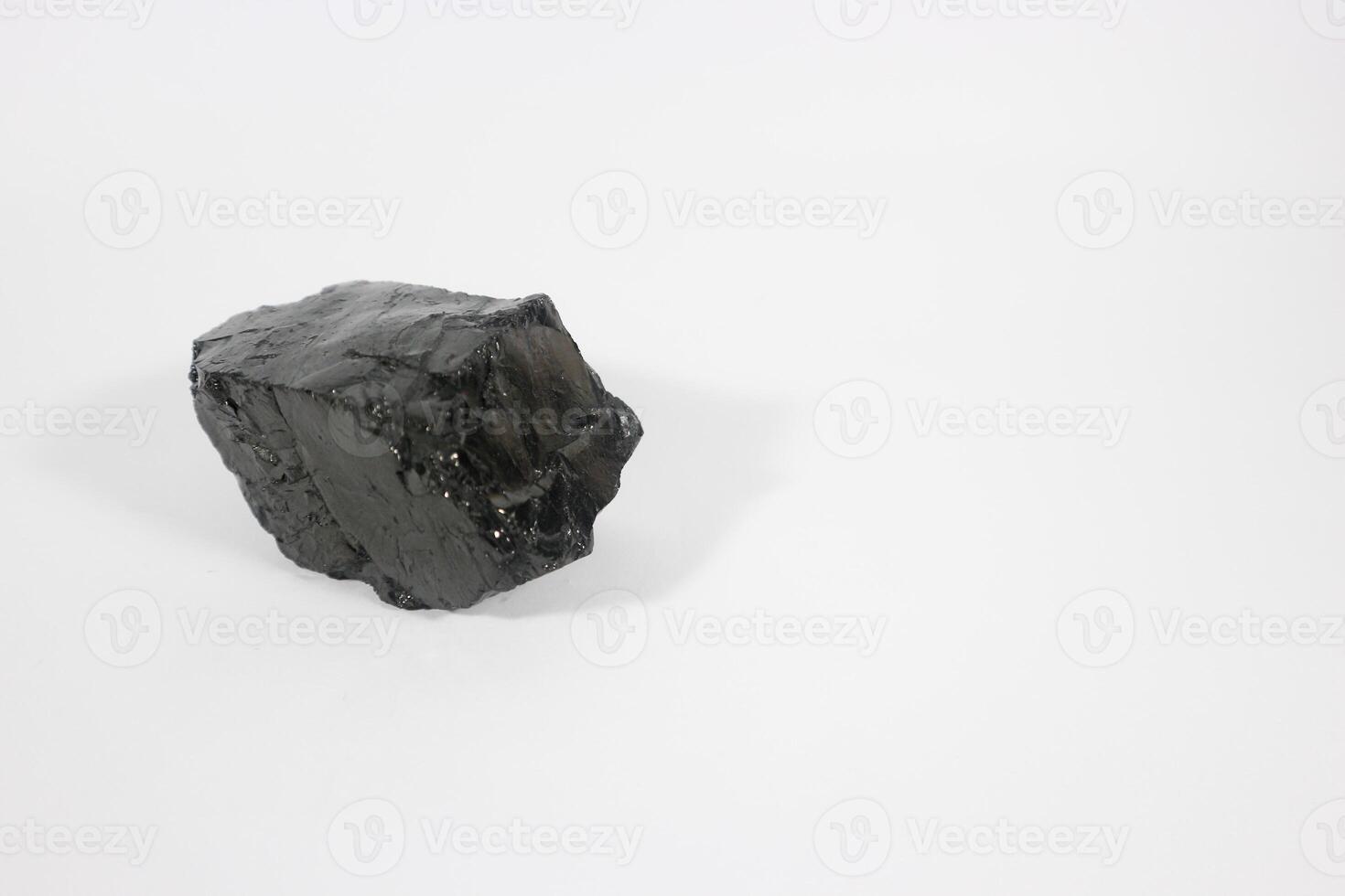 coal on a white background. Isolated on white. Coal can be a fuel that is cheaper than others photo