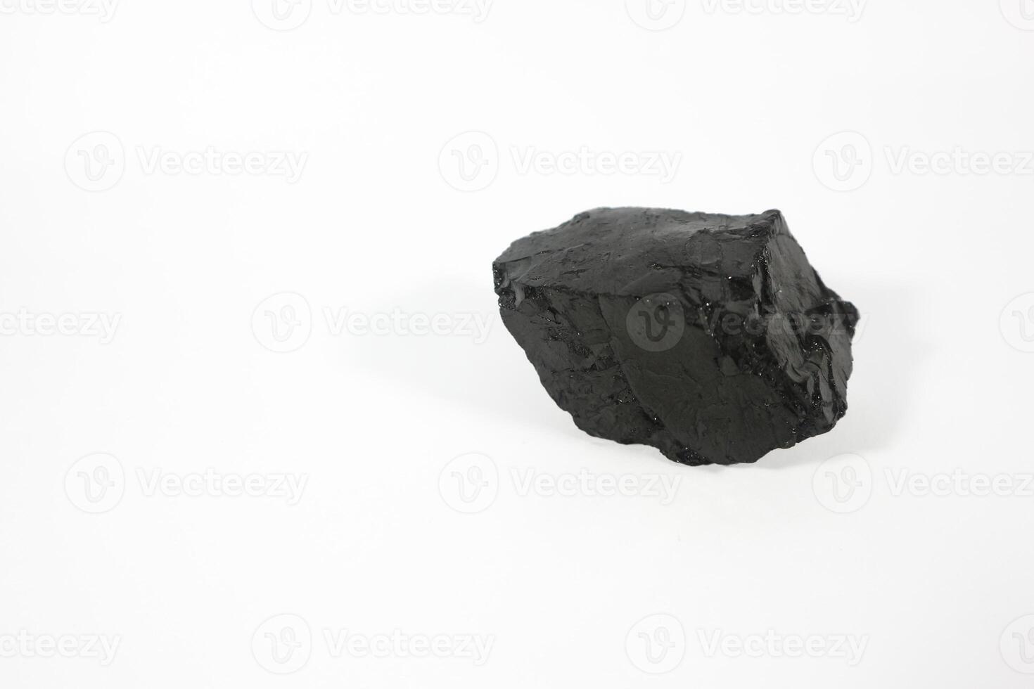 coal on a white background. Isolated on white. Coal can be a fuel that is cheaper than others photo
