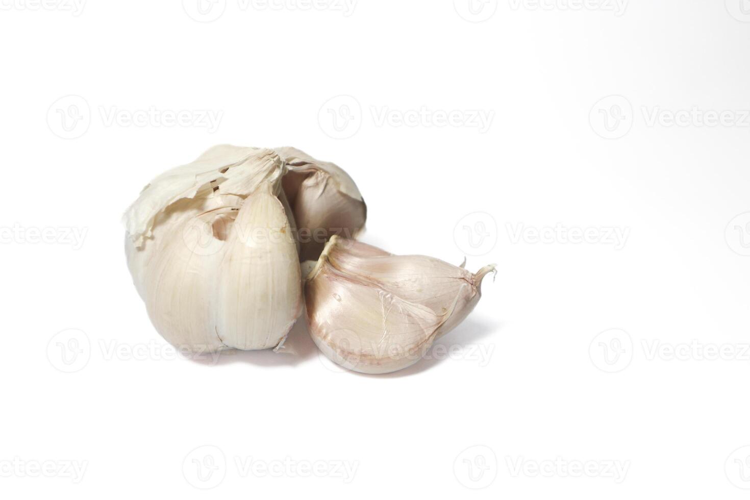 Isolated garlic. Raw garlic with segments isolated on white background photo