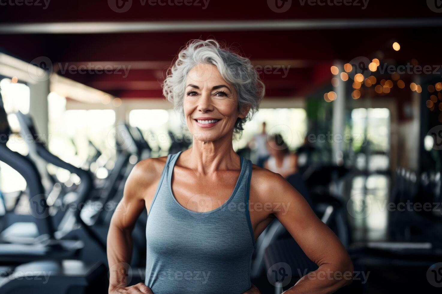 A determined elderly woman engages in vigorous workouts at the gym, embodying strength, perseverance, and commitment to a healthy and active lifestyle.Generated image photo