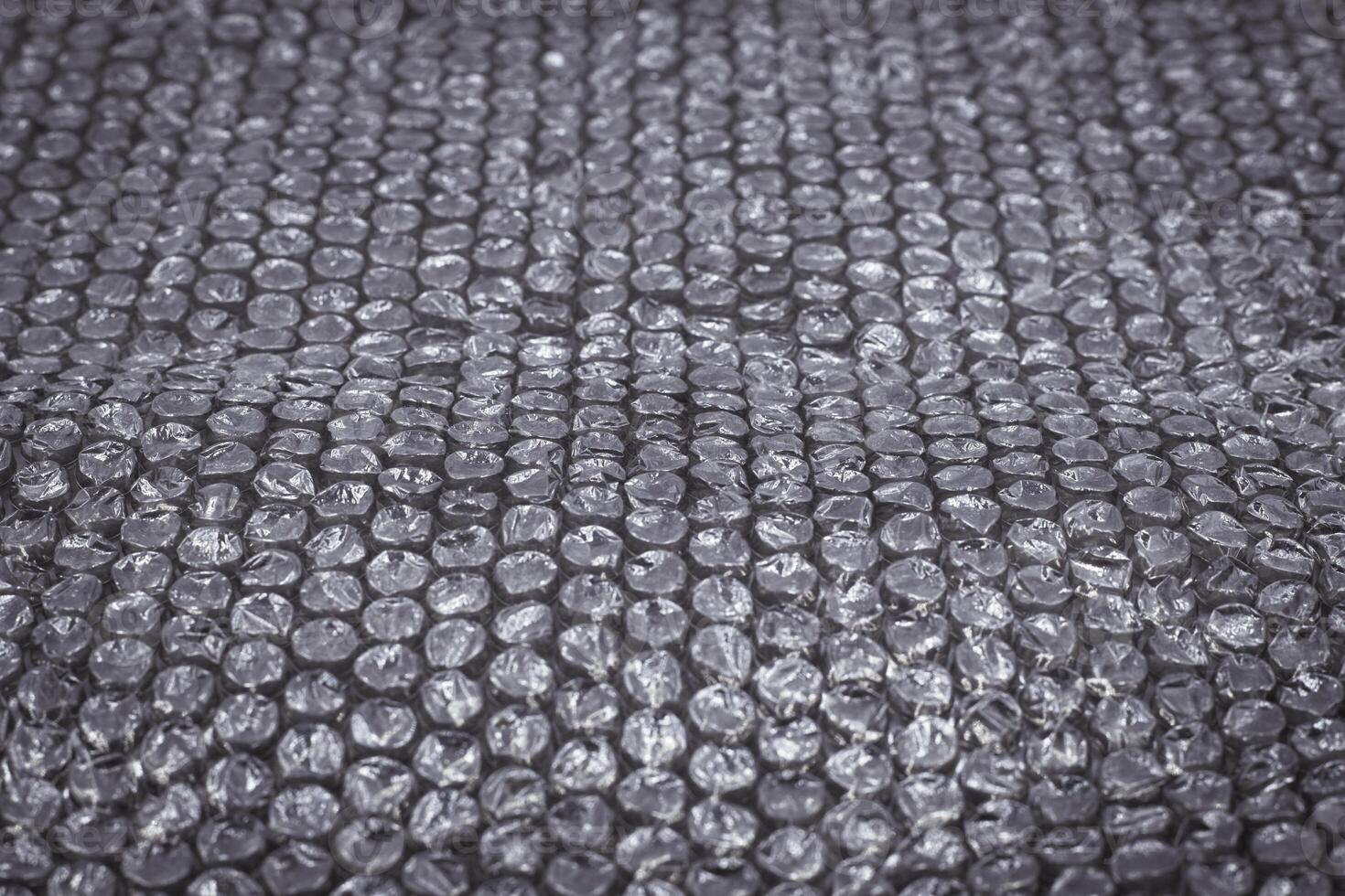 black bubble plastic wrap surface, Air Bubble wrap texture background. Plastic packaging material. photo