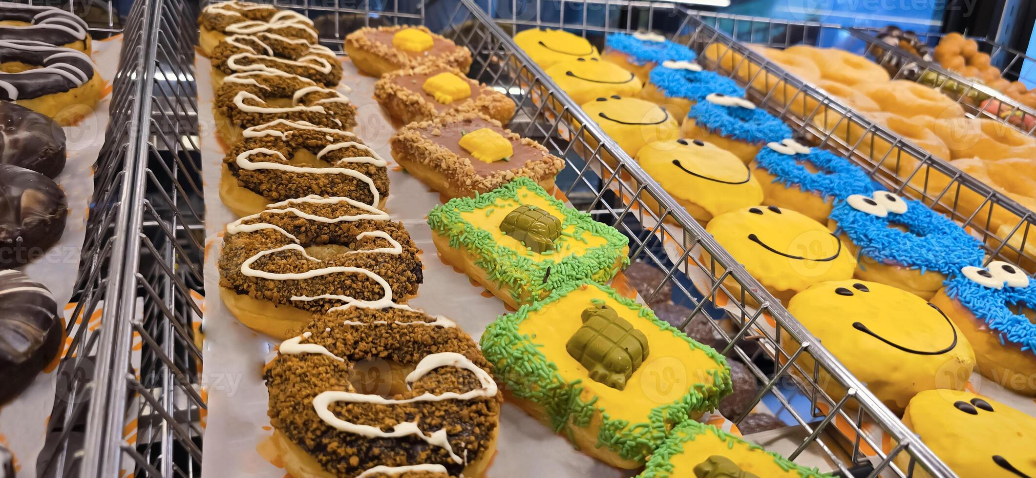 Delicious assortments of sugary donuts with different flavors and colorful topping good for backgrounds and multimedia content photo
