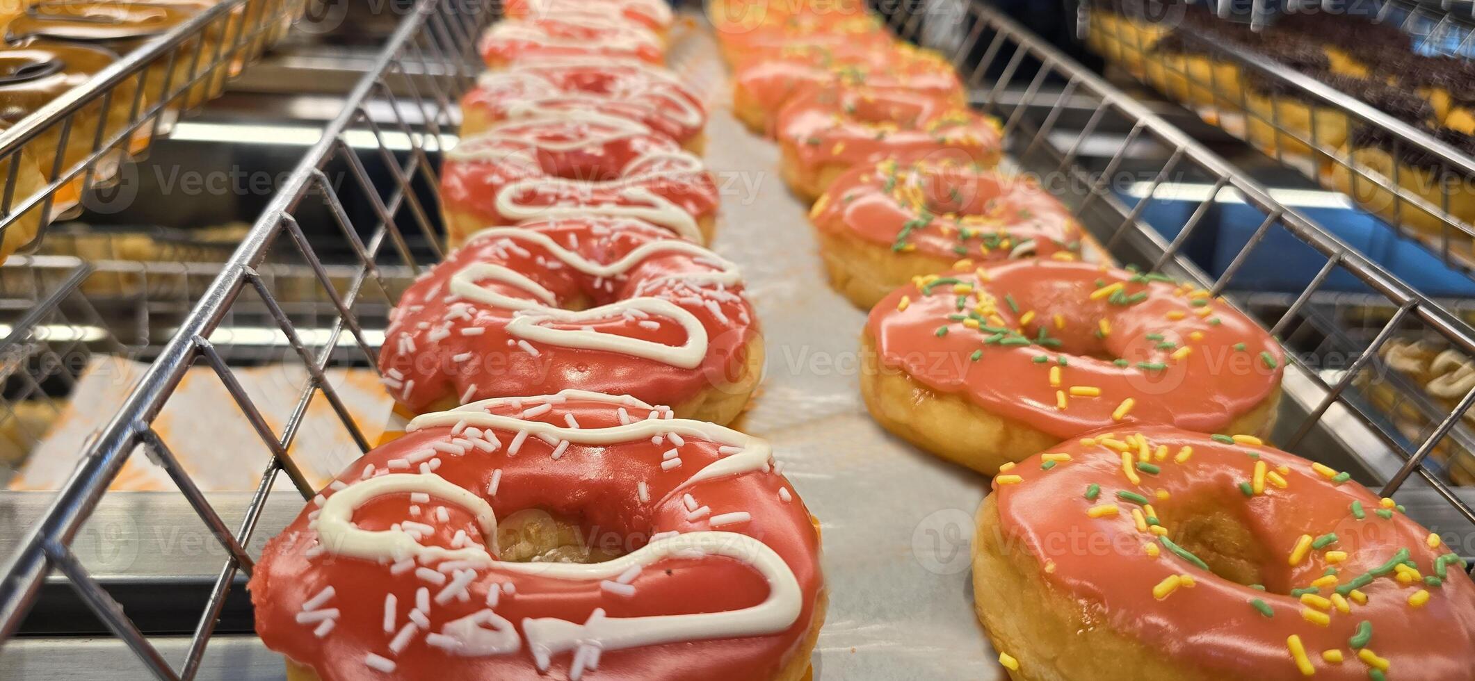 Delicious assortments of sugary donuts with different flavors and colorful topping good for backgrounds and multimedia content photo