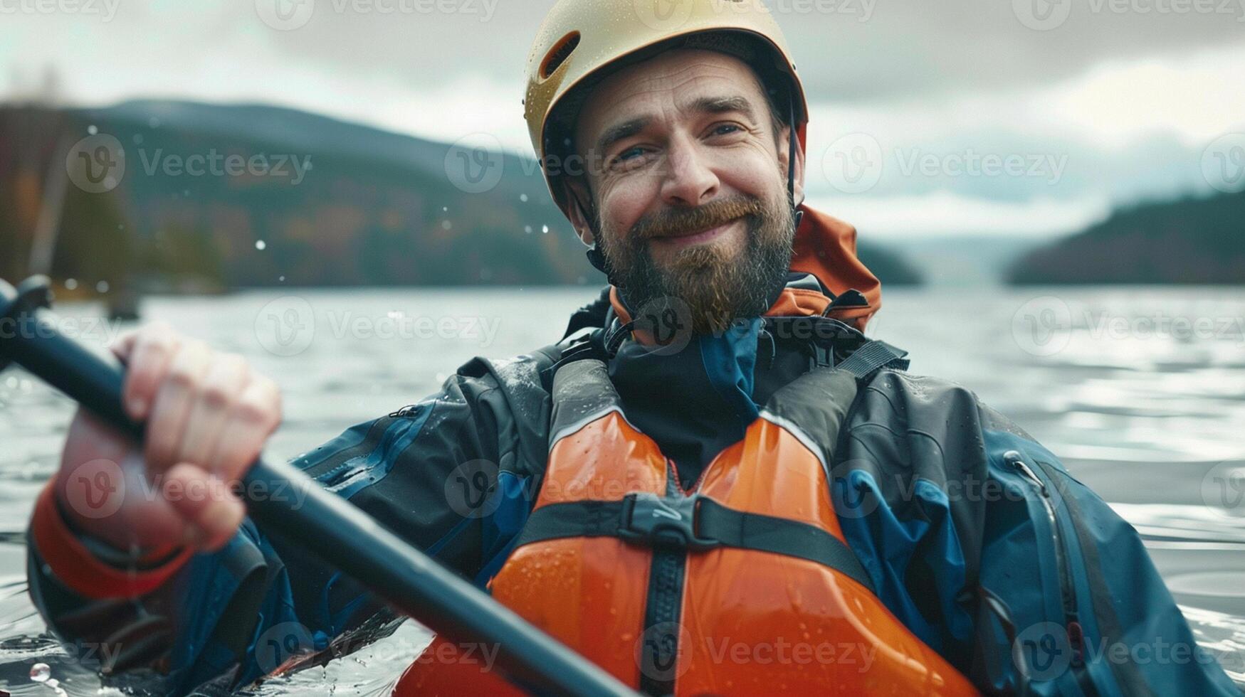 Kayaking and canoeing. An happy athletic man is kayaking close-up. photo