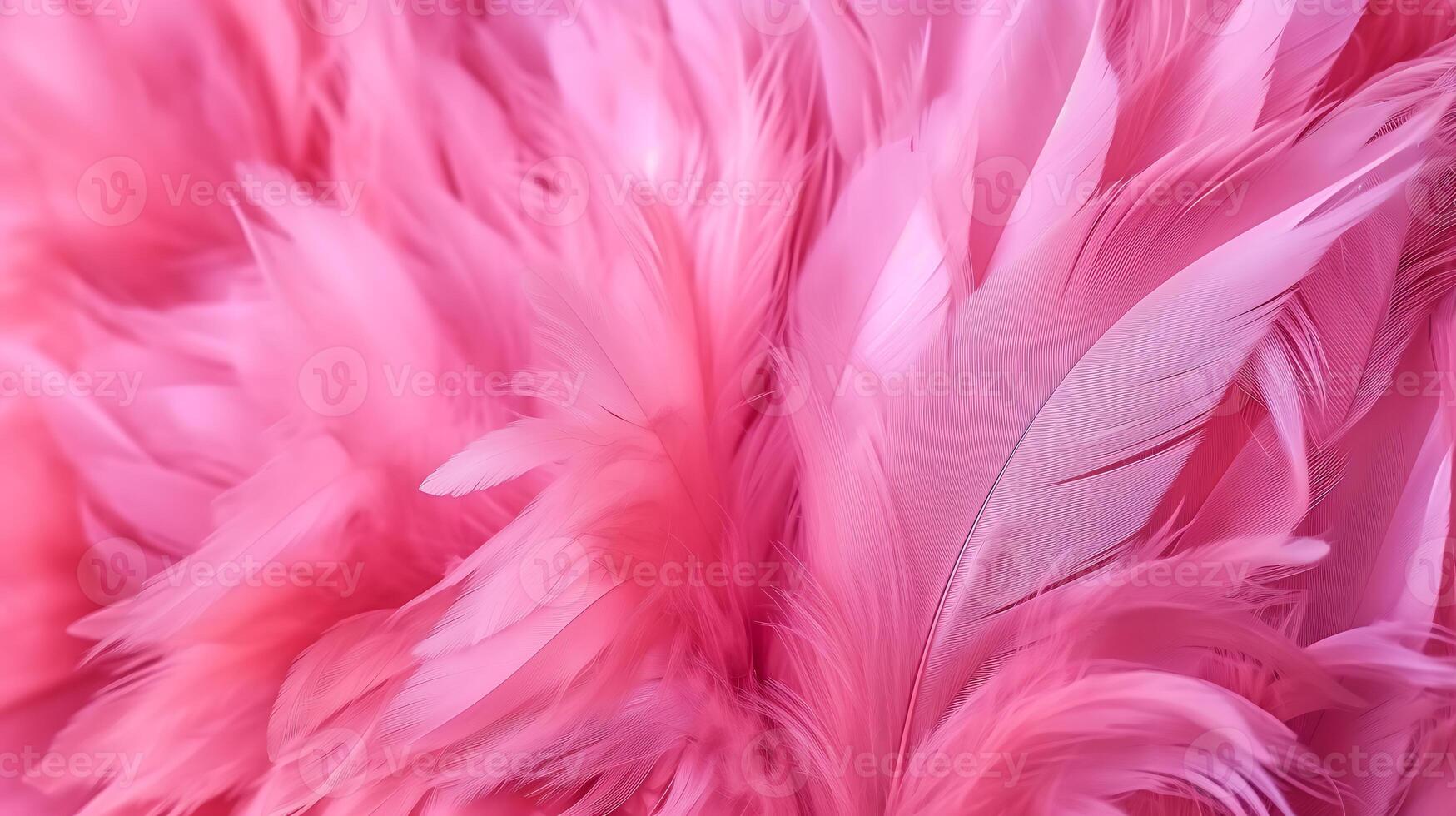 Pink flamingo feathers in neon colors. Fluffy background with a close-up. photo