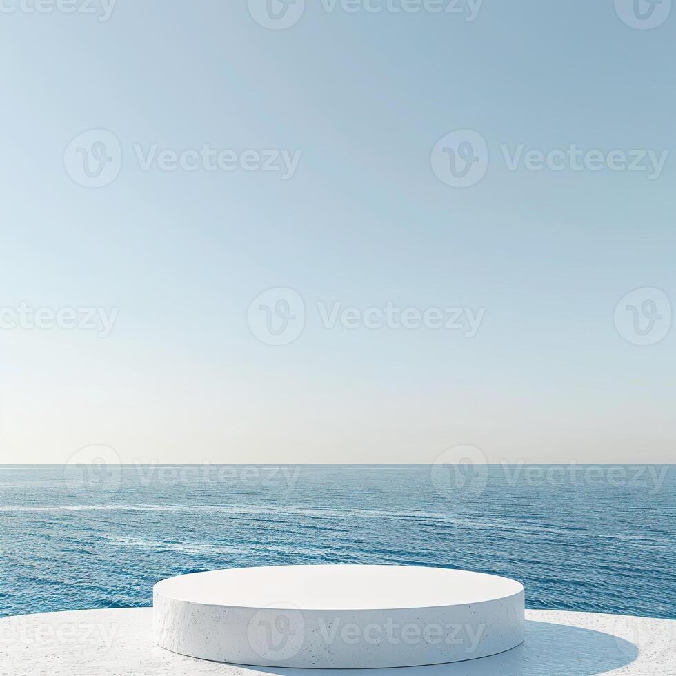 A round podium on the beach, surrounded by sand and sea in light beige tones photo
