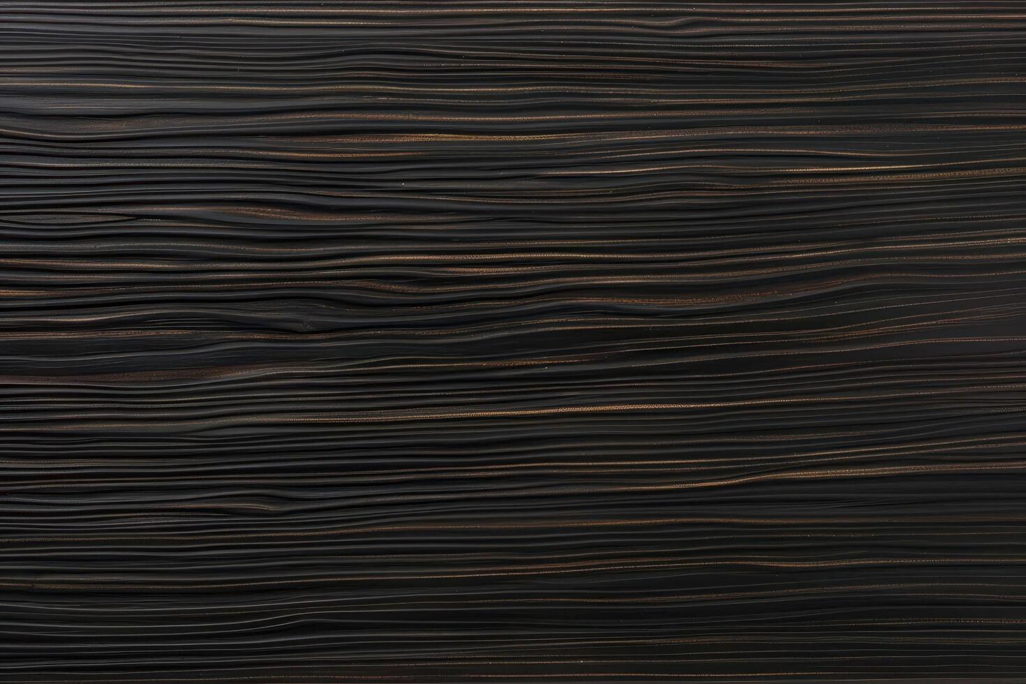 The ebony wood grain background features rich, dark tones and intricate patterns photo