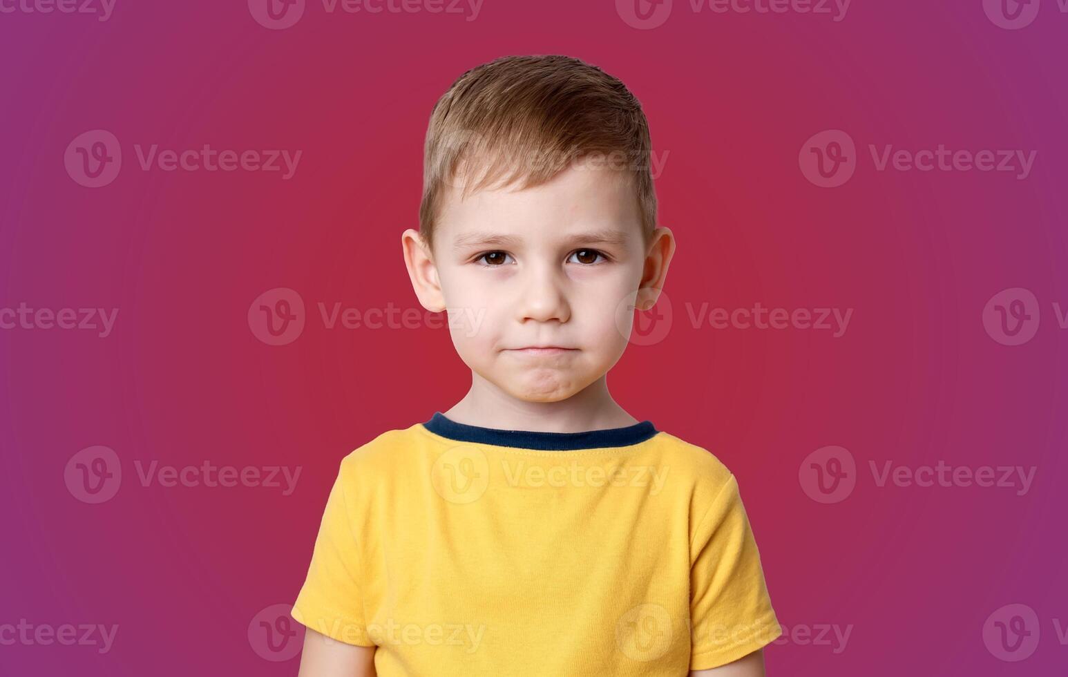 portrait of a little boy with the emotion of misunderstanding, surprise thoughts photo