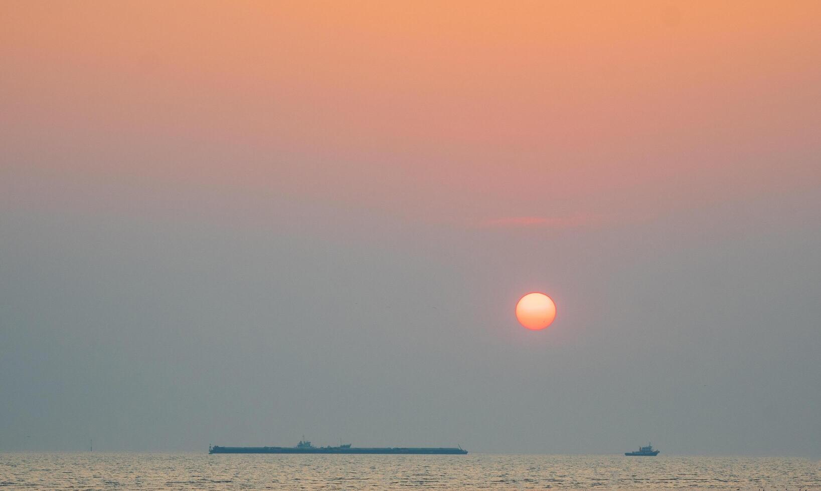 Panoramal front viewpoint landscape travel summer sea wind wave cool holiday calm coastal big sunset sky light orange golden Nature tropical Beautiful boat evening day At Bangpoo SamutPrakan Thailand photo