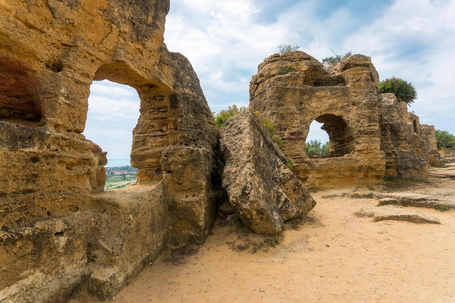 Agrigento, Italy-May 10, 2022-the imposing Greek Temple of Juno inside the Valle di Templi archaeological park near Agrigento during a sunny day photo
