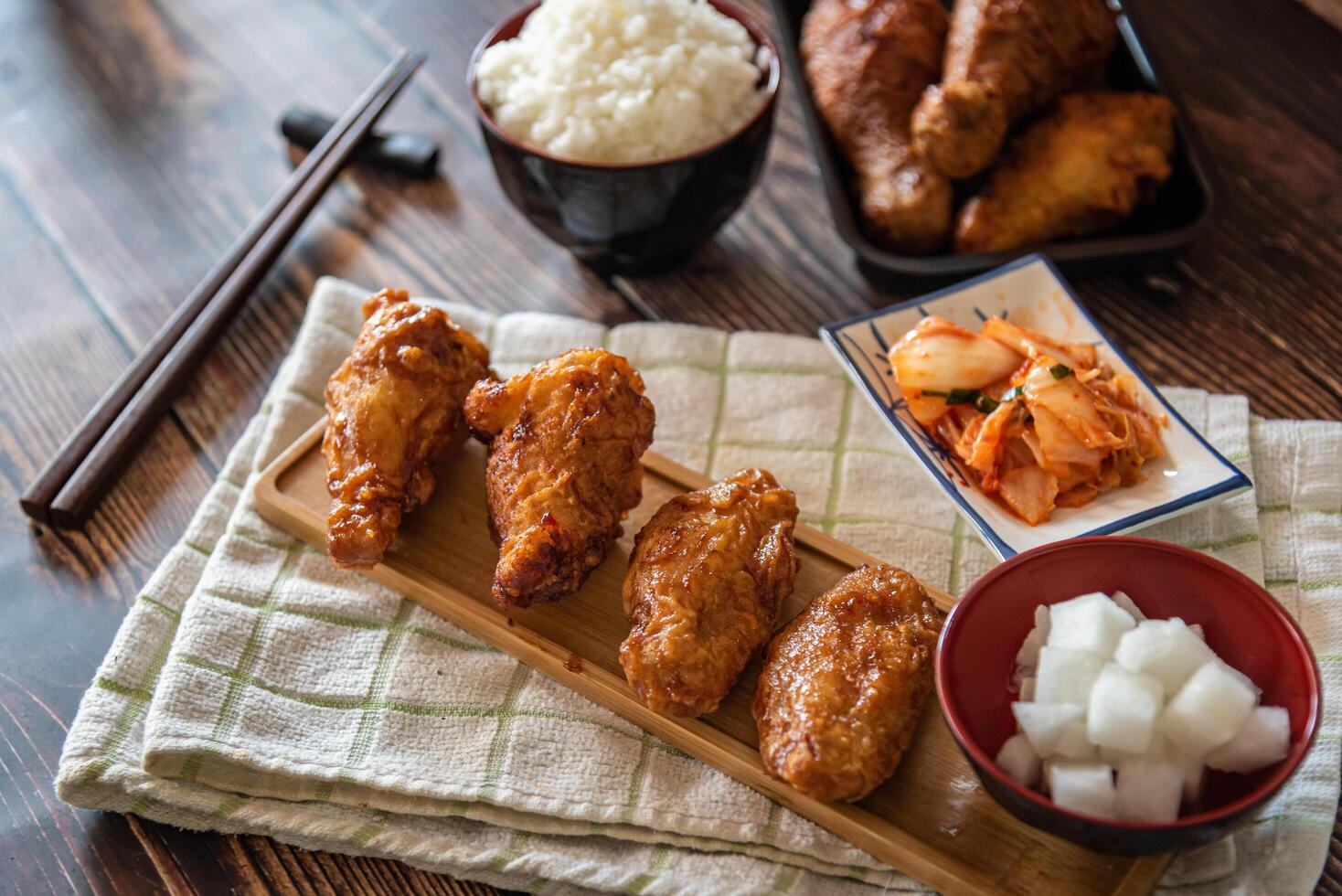 Korean fried chicken with garlic sauce and kimchi, drumstick and wings for menu photo