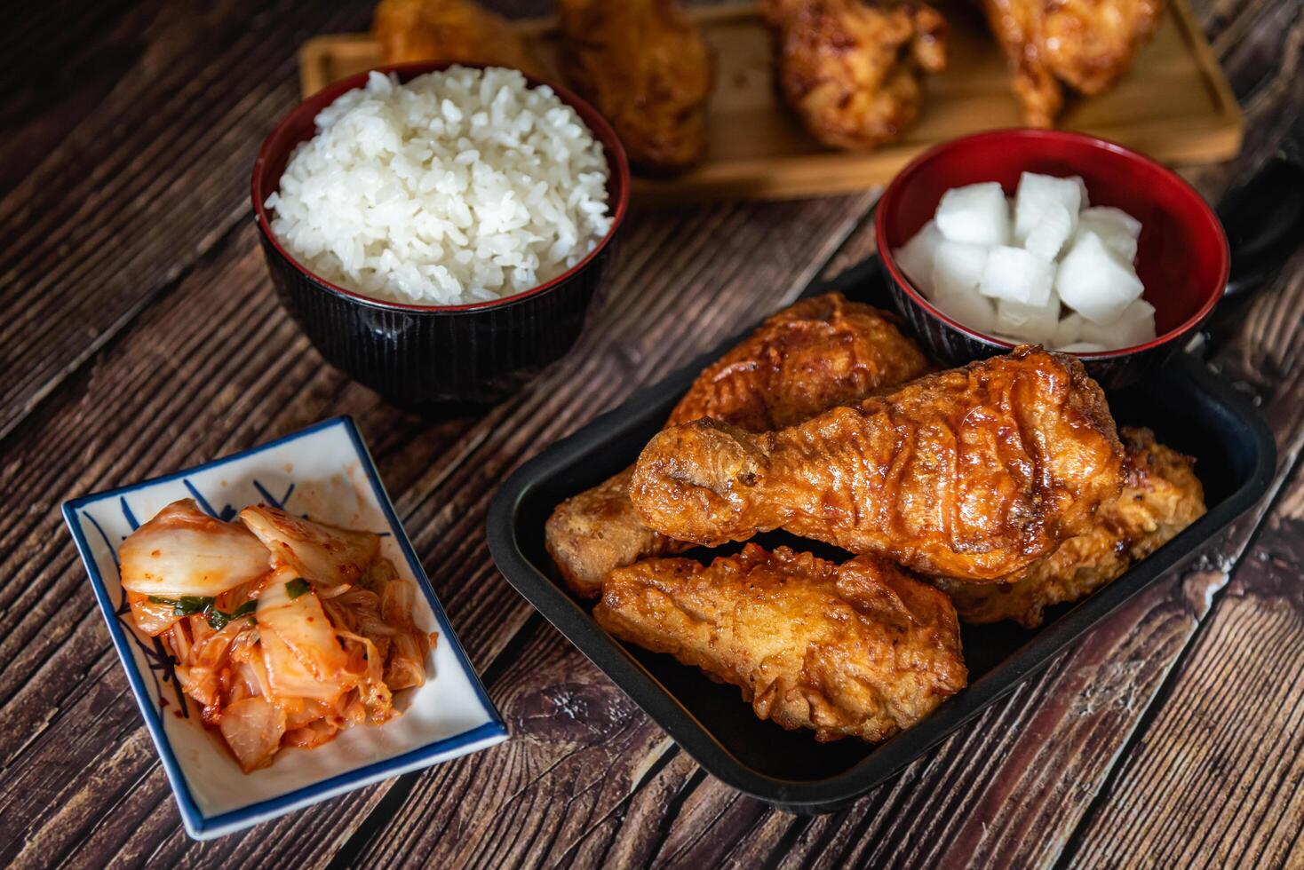 Korean fried chicken with garlic sauce and kimchi, drumstick and wings for menu photo