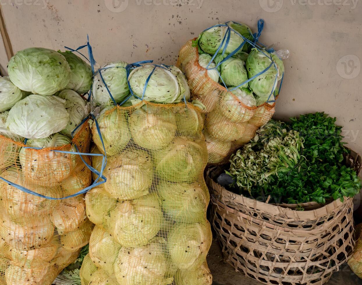 vegetables in sacks ready to be distributed to traditional markets photo