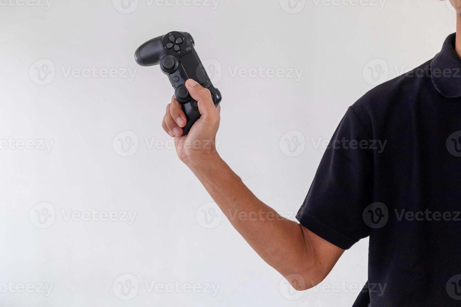 Man holding a gamepad controller or joystick on a white background photo