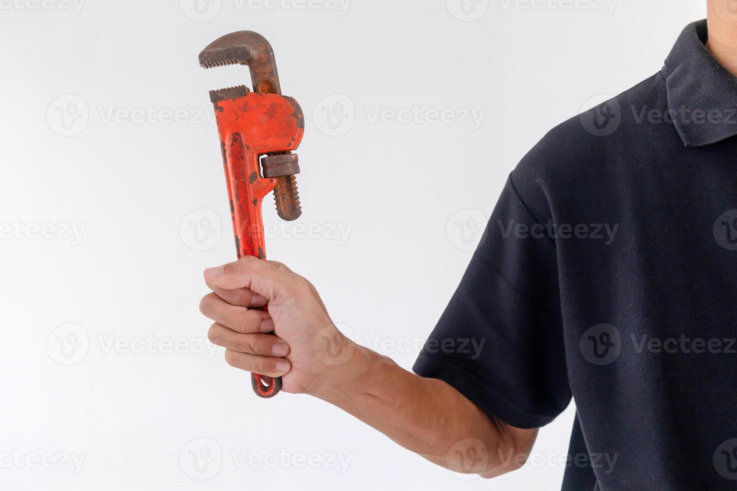 Man holding a pipe wrench on a white background photo