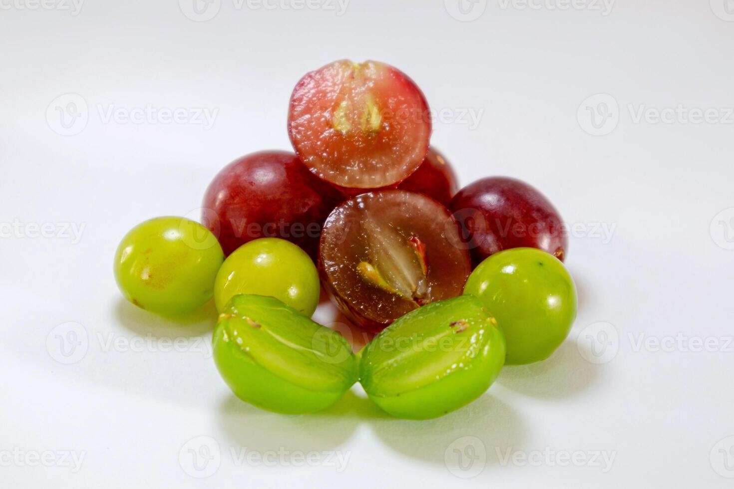 Fresh red and green grapes isolated on a white background photo