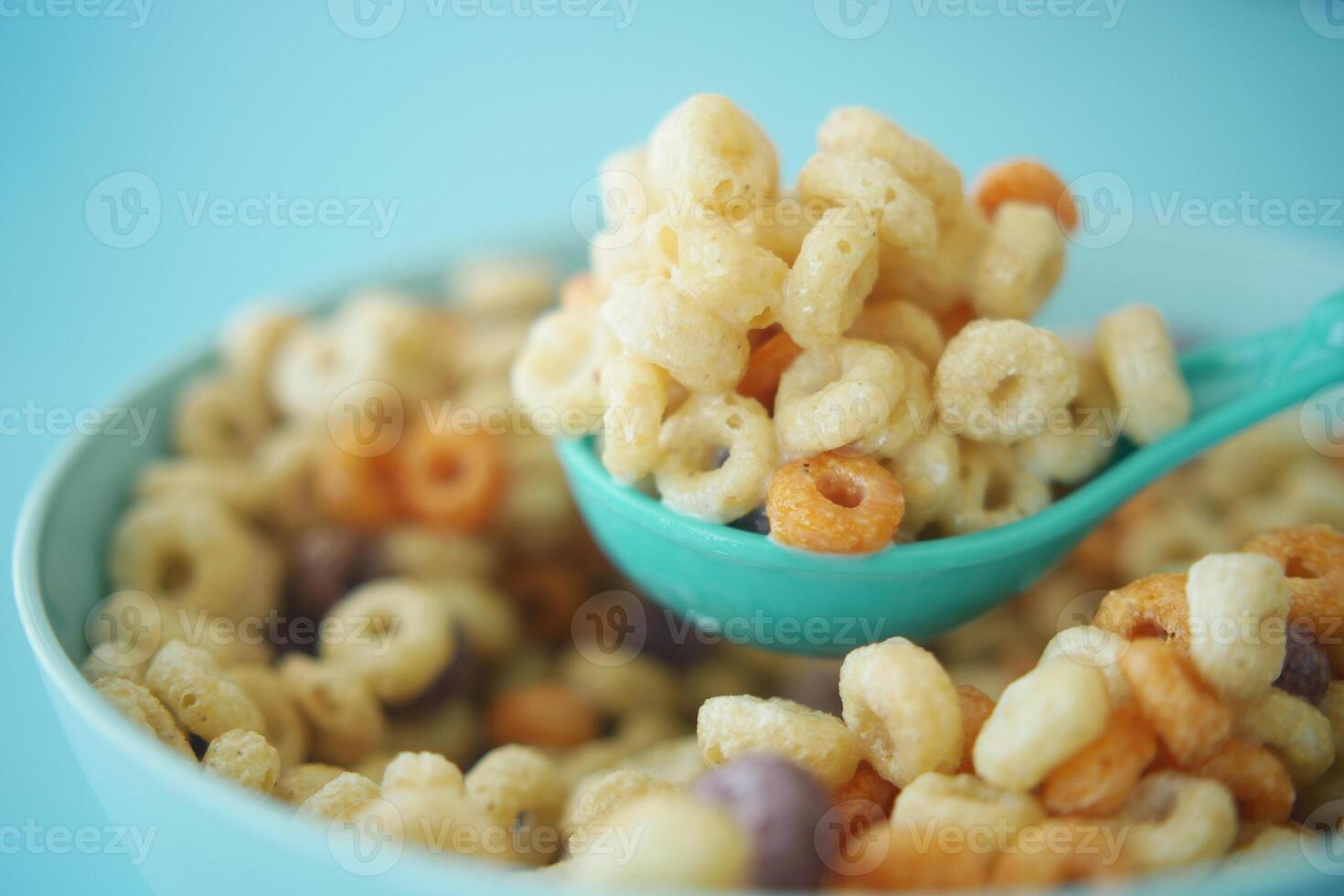 close up of colorful cereal corn flakes in a bowl photo