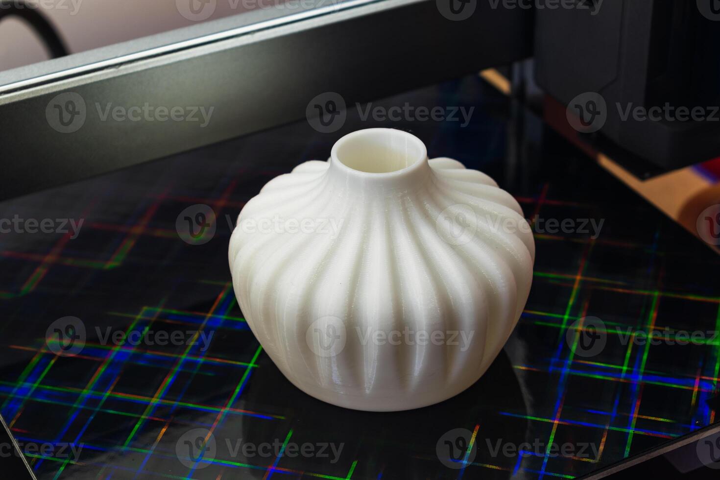 Four heads 3d printer, four extruders with an object on the tray, pla filament photo