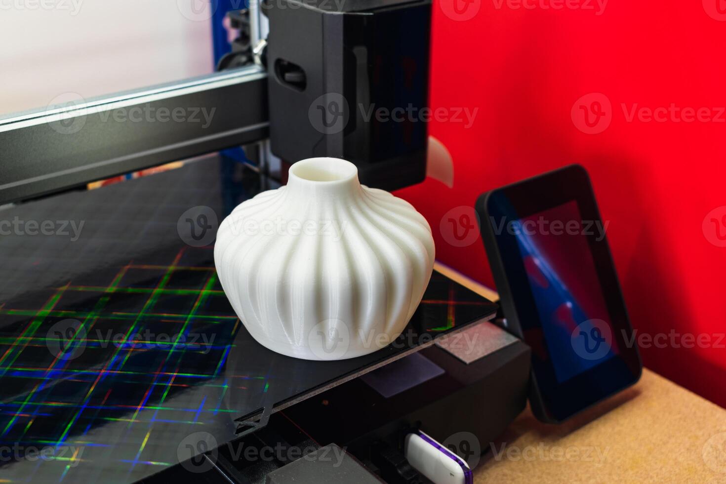 Four heads 3d printer, four extruders with an object on the tray, pla filament photo