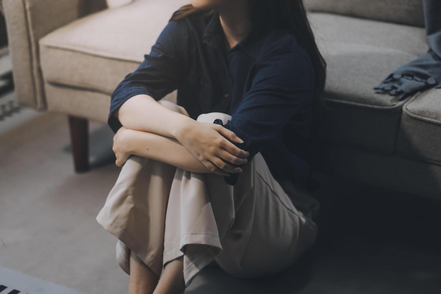 A woman with a cold with pills is treated at home chooses which drugs to take and self-medicates, checks the expiration date while sitting on the couch at home photo