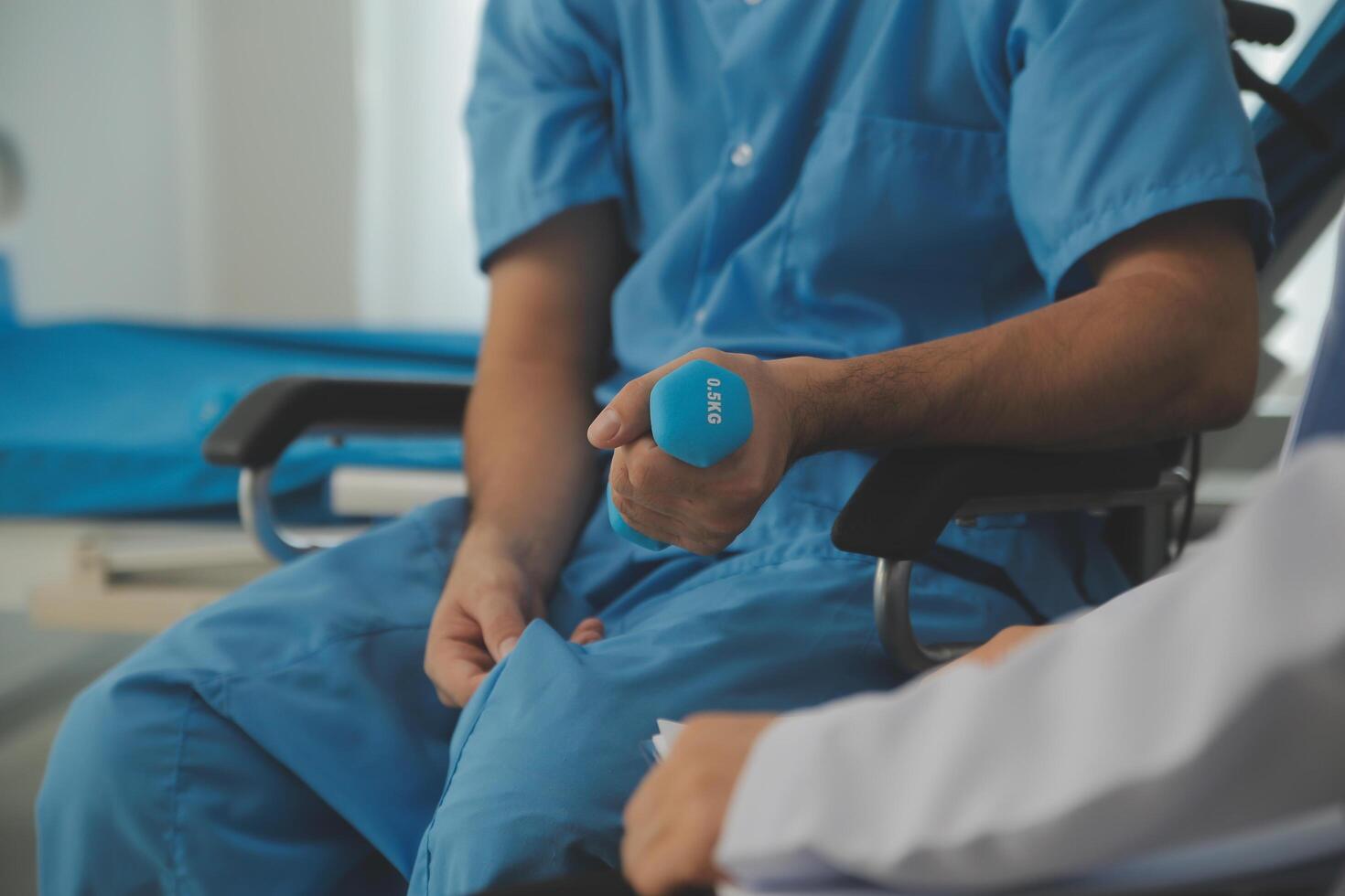Physiotherapist man giving exercise with dumbbell treatment About Arm and Shoulder of athlete male patient Physical therapy concept photo