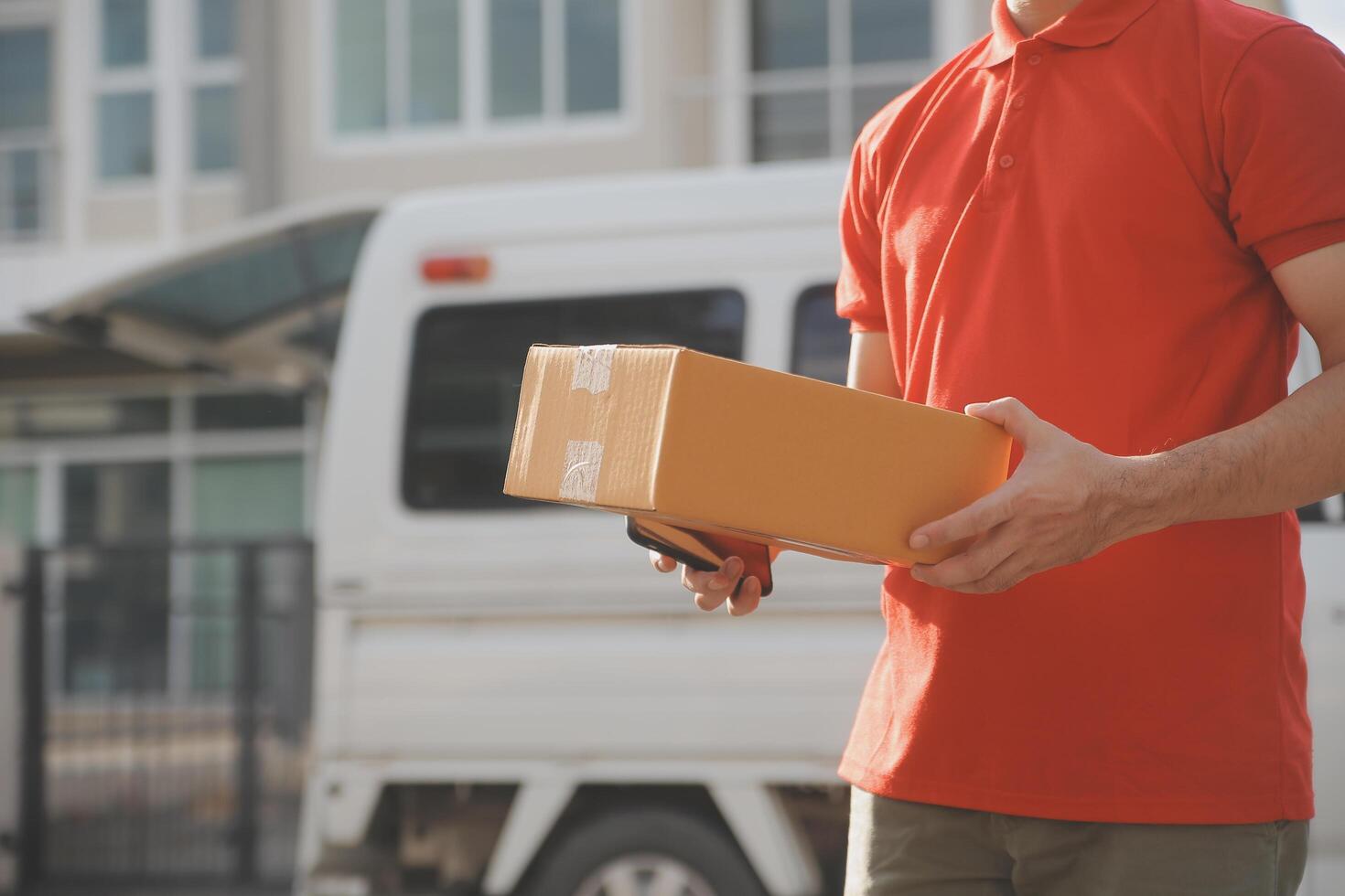 Asian delivery express courier young man use giving boxes to woman customer he wearing protective face mask at front home photo