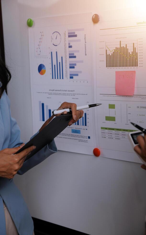 Team of business people working together in the meeting room office, teamwork background charts and graphs banner, double exposure successful teamwork,business planning concept. photo