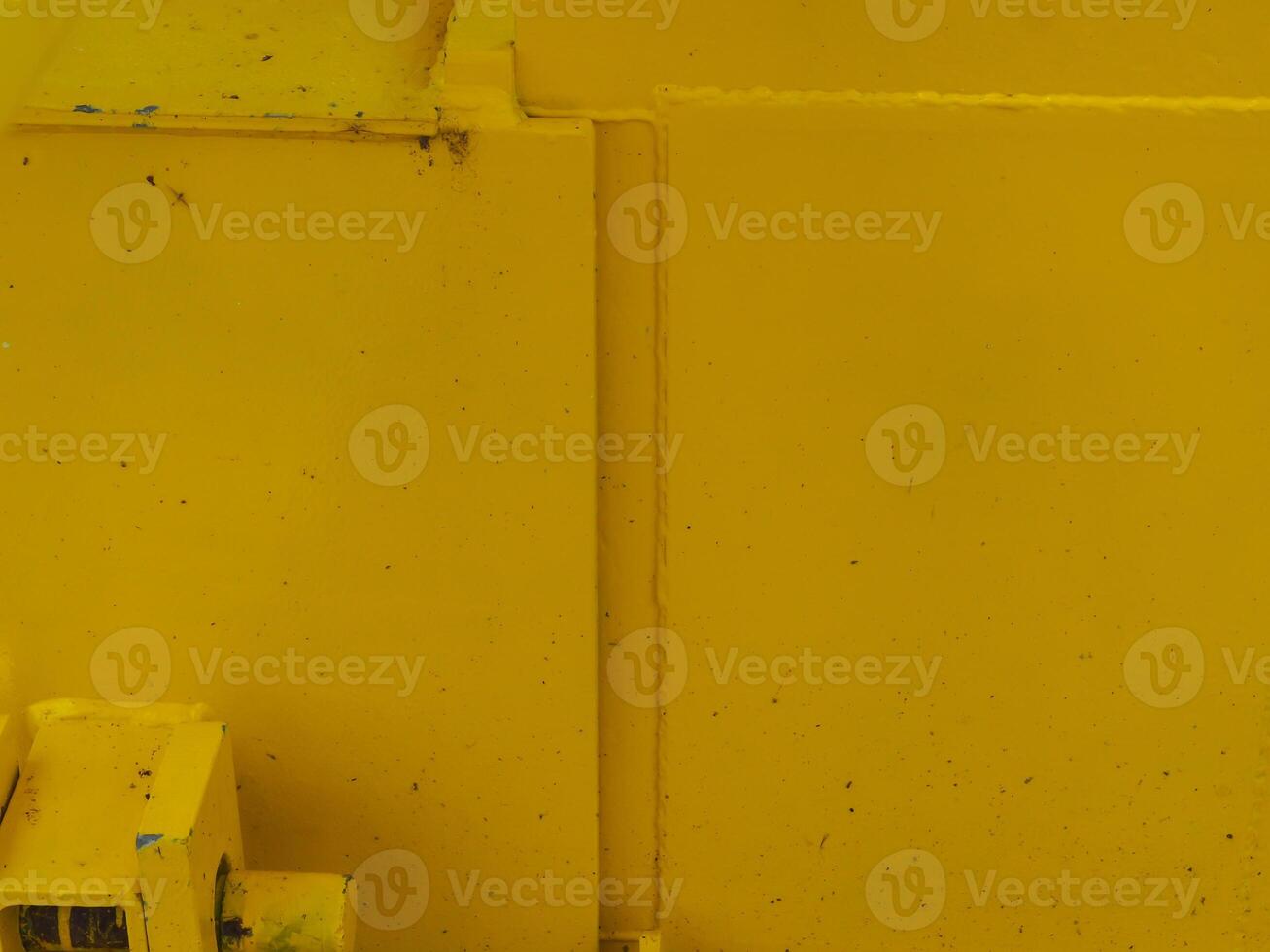 Yellow painted steel texture for a close-up background of a building or construction. photo