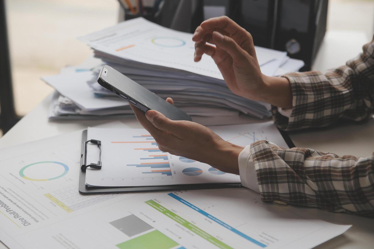 Group of confident business people point to graphs and charts to analyze market data, balance sheet, account, net profit to plan new sales strategies to increase production capacity. photo