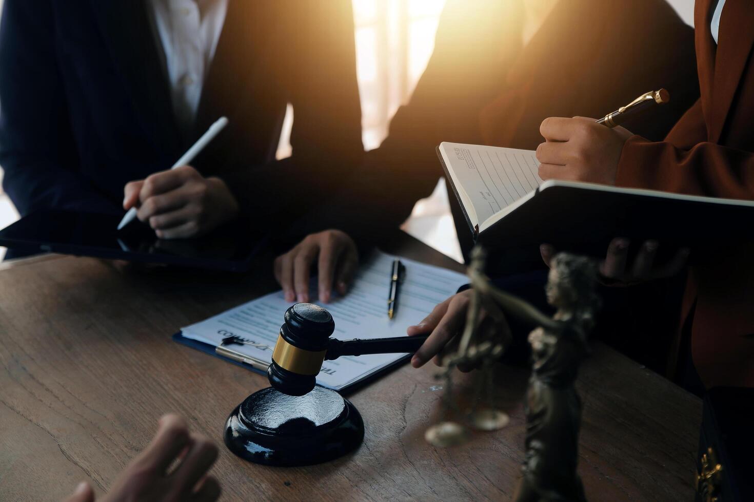 Lawyer, legal advisor, businessman brainstorming information on agreement details Business contracts in legal processing books for accuracy in contract documents. joint financial investment. photo